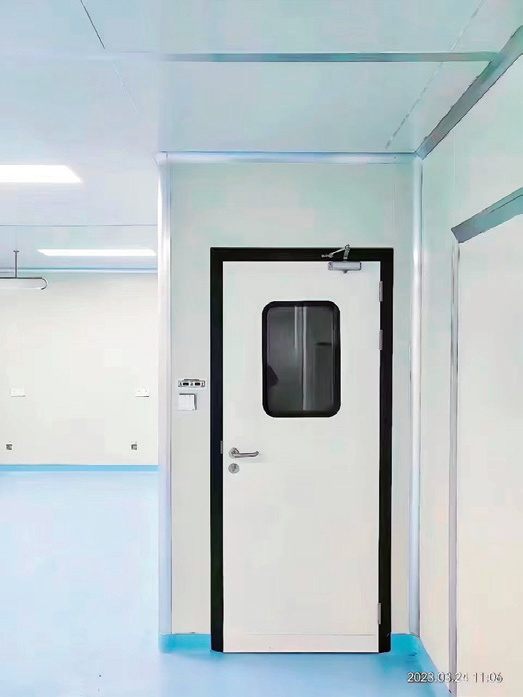 Custom cleanroom steel door with drop seal, viewing window and interlock